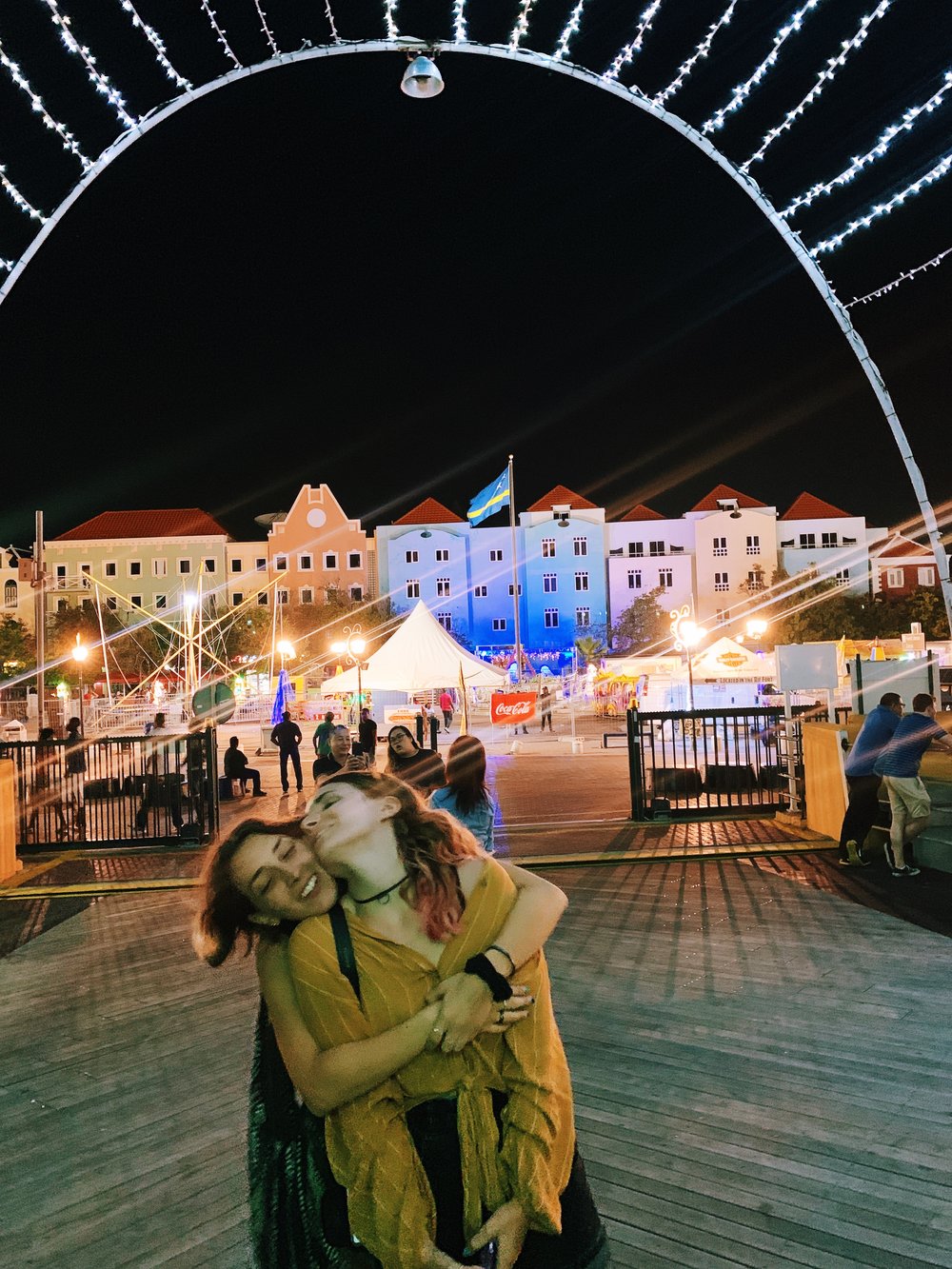 Get your pictures taken at the famous Queen Emma bridge during the night 